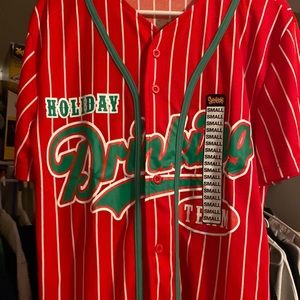 Spencer’s Christmas jersey, size small, and colors are red white and green.